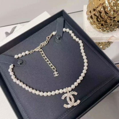 New pearl and diamond logo necklace